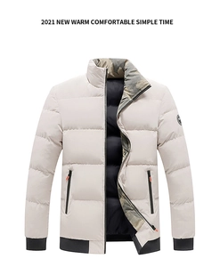 Detail of winter puffer jacket featuring camouflage collar lining and arm logo patch
