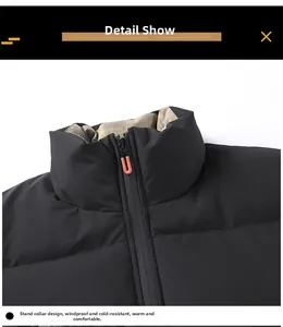 Detail of stand-up collar on black winter jacket with windproof zip and orange puller