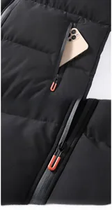 Detailed close-up of winter jacket zipper and pocket holding a smartphone