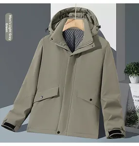 Detail of light grey-green outdoor jacket showing velcro cuffs and cargo snap pockets