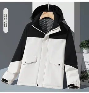 Detail of hooded jacket featuring silver-white and black contrast with honeycomb lining