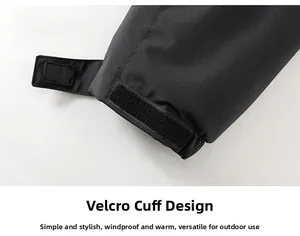 Detailed close-up of adjustable velcro cuffs on this black waterproof outdoor jacket sleeve