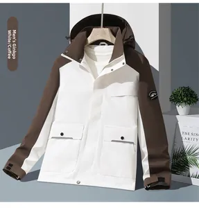 Detail of outdoor jacket showing contrast colors, mountain badge and cargo pockets