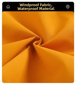 Detailed macro view of high-performance windproof and waterproof functional fabric in bright yellow