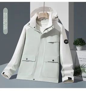 Close-up of hiking jacket featuring contrast panels and circular mountain sleeve badge