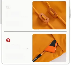 Detail of orange outdoor jacket featuring leather drawstring and zipped pocket with fashion logo