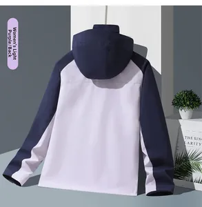 Rear view of a light purple and navy blue waterproof outdoor windbreaker with a hood