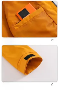 Detailed view of bright orange jacket featuring side pockets and adjustable velcro cuffs