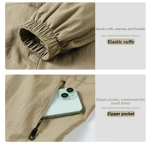Dettaglio della giacca outdoor kaki con polsini elastici e tasche laterali con zip