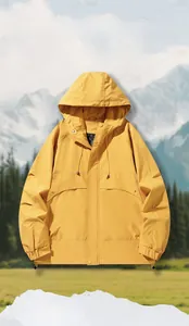 Detail of a bright yellow hooded outdoor jacket with windproof fabric and adjustable drawstring
