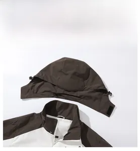 Detail of outdoor jacket with detachable hood and breathable mesh lining and collar