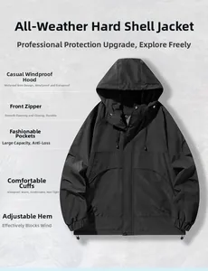 Detail view showing the waterproof zipper and wide brim hood of the black tactical jacket