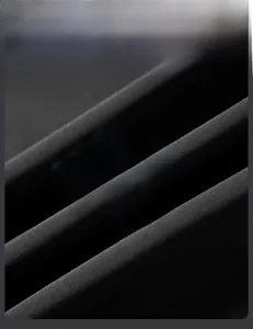 Macro shot of breathable tech fabric texture with moisture-wicking and heat vent indicators