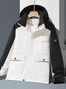 Outdoor color-block waterproof jacket in black and white with a hood and velcro cuffs