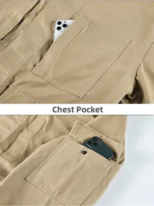 Detail of khaki work jacket featuring a chest pocket with zipper and metallic button