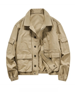 Close-up of khaki multi-pocket utility jacket featuring durable cotton twill and flap pockets