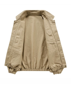Detail of khaki cotton jacket showing inner pockets and elastic hem construction