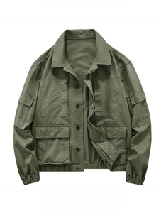 Army green cargo jacket detail featuring four large utility pockets and cotton twill texture