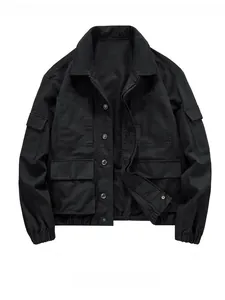 Detail of black workwear jacket showing multiple utility pockets and durable fabric texture