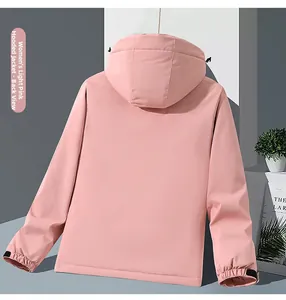 Back view of a light pink hooded outdoor jacket for women with windproof adjustable cuffs