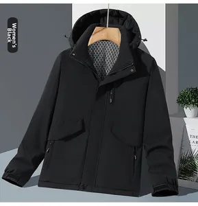 Detail of black waterproof hooded jacket with hexagonal honeycomb lining and zip pockets