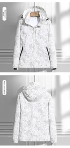 Detailed front and back views of an ivory windbreaker with tropical leaf print and hood