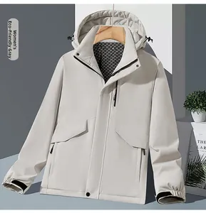 Detail view of water-resistant gray outdoor jacket with breathable honeycomb lining and hood