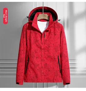 Detail of red maple leaf camouflage windbreaker featuring zipper and hood