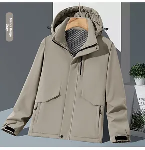 Detail of grey outdoor hooded jacket featuring windproof pockets and adjustable cuffs