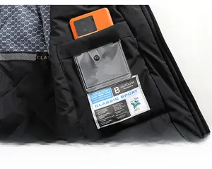 Detail view of water-resistant outdoor jacket interior with honeycomb lining and hidden pocket