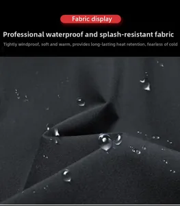 Macro shot of waterproof fabric showing water droplets on black outdoor jacket material