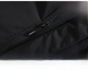 Close-up of windproof nylon zipper and honeycomb fleece lining on the outdoor jacket