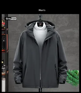 Detailed view of dark grey hooded jacket with zipper pockets and windproof fabric