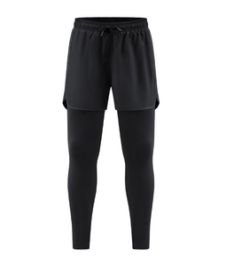 Detail of men's 2-in-1 compression pants with elastic waistband and drawstring