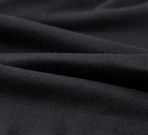 Macro shot of breathable black knit fabric texture for men's athletic running leggings