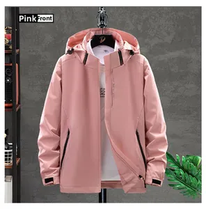 Detailed view of pink outdoor windbreaker with adjustable velcro cuffs and zip closure