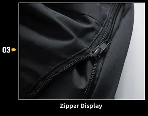 Close-up of black metal zipper detail on waterproof outdoor jacket fabric
