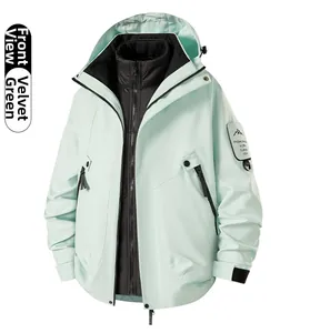 Detail of mint green 3-in-1 waterproof jacket with detachable black liner and sleeve patch