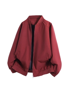 Classic red baseball jacket with stand collar and silver zipper on white background