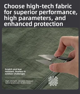 Detail of dark green anti-scratch technical fabric undergoing tear-resistance test