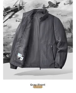Detail view of grey lightweight outdoor jacket showing high-density windproof fabric and zipper