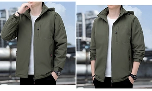 Detail view of olive green outdoor jacket with adjustable hood and zipper pockets