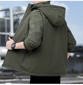 Detail showing tactical sleeve embroidery and elastic windproof cuff on olive jacket