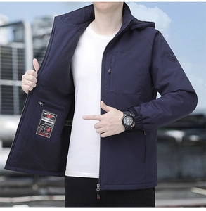 Detailed view of dark blue fleece jacket with inner pocket and durable zipper detail