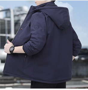 Detail of windproof outdoor jacket sleeve with outdoor embroidery and elastic cuff