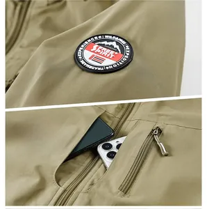 Detail of fleece jacket showing arm patch and functional zipper pocket construction