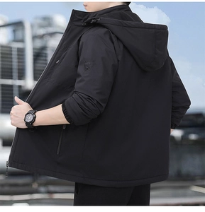 Detail of men's black fleece jacket featuring drawstring hood and embossed sleeve logo