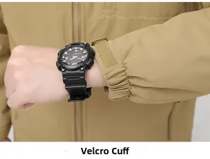 Detail view of khaki outdoor jacket showing adjustable velcro cuffs and windproof fabric