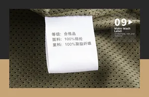 Close-up of wash label for army green jacket, 100% nylon shell and polyester lining