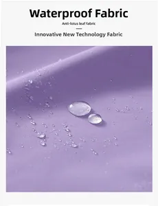 Macro shot of purple waterproof fabric with water droplets showing lotus leaf effect